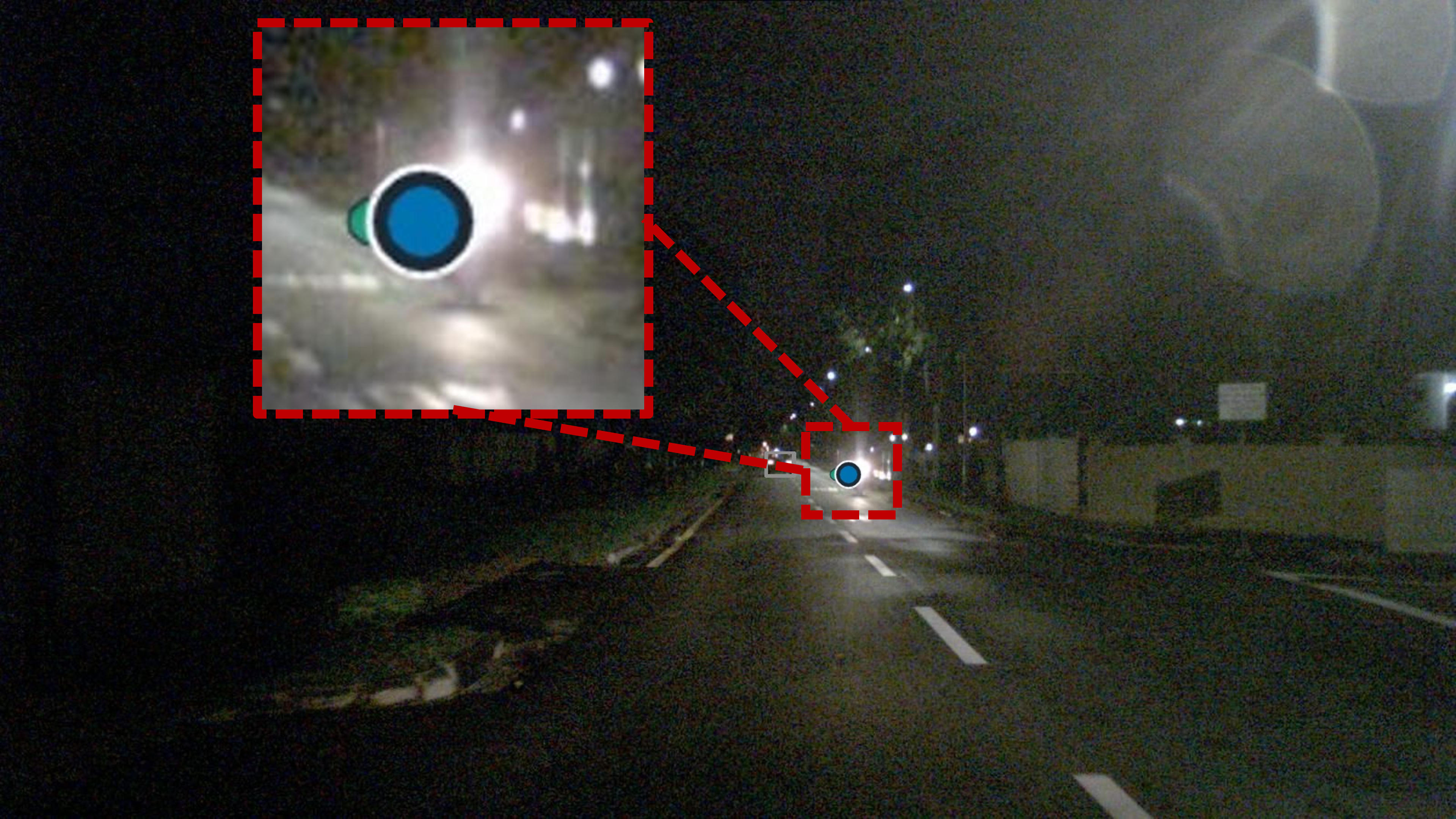 Unannotated motorcycle under headlight glare detected by PART.